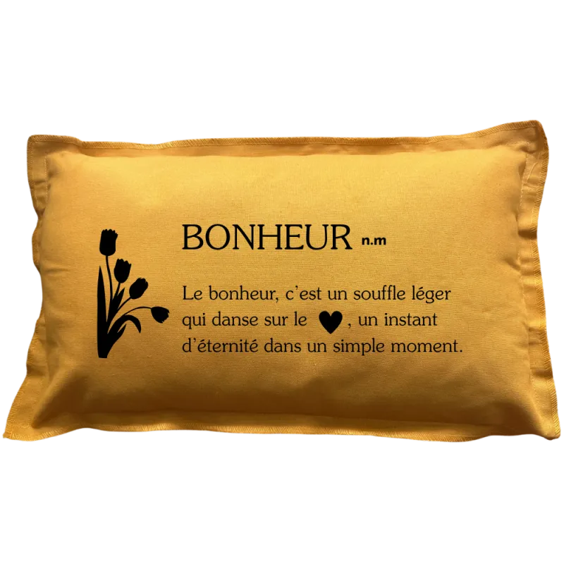 Coussin rectangulaire beige avec la définition du mot : Bonheur